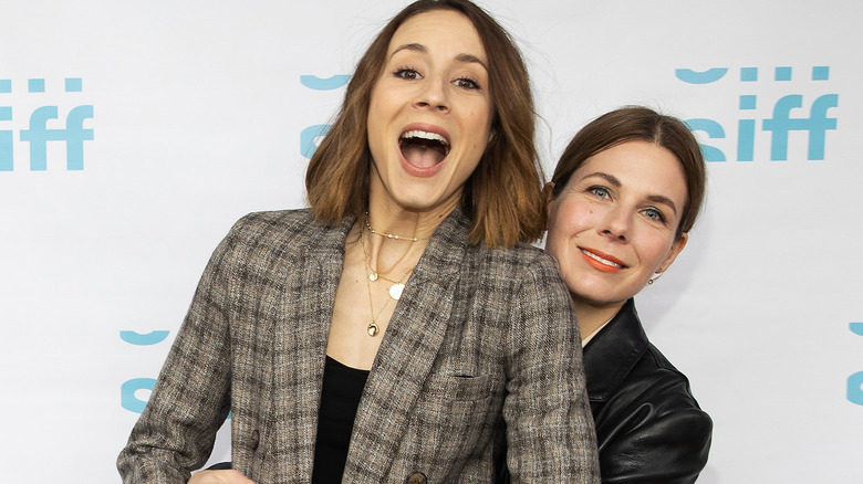 Cheryl Nichols and Troian Bellisario posing on a red carpet