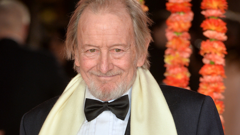 Ronald Pickup smiling at event