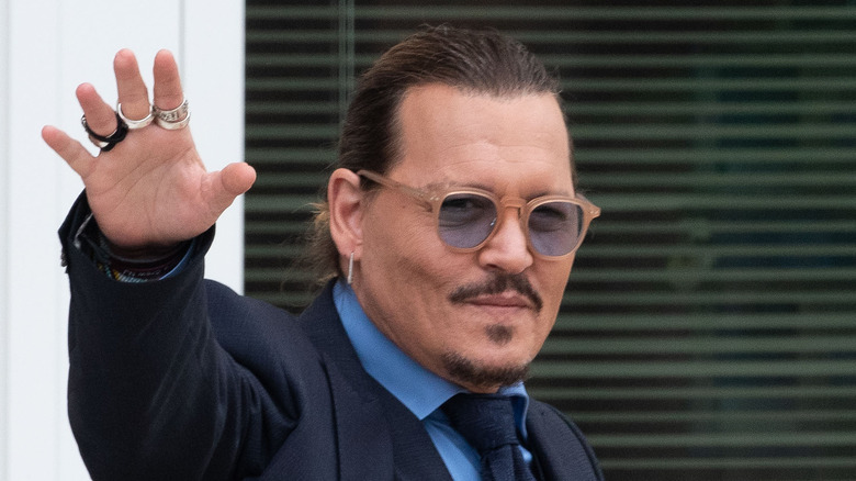 Johnny Depp waving to supporters and reporters in Virginia