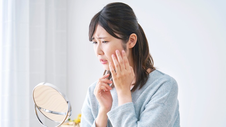 A woman looking in the mirror 