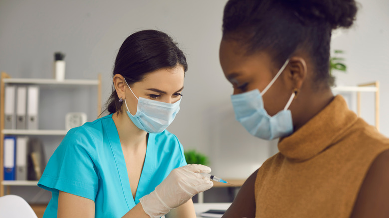 Woman receiving vaccine