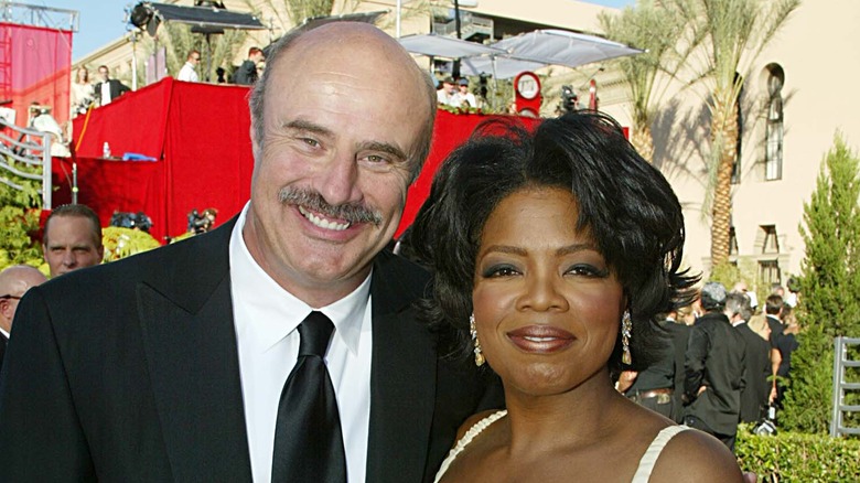 Dr. Phil McGraw and Oprah posing