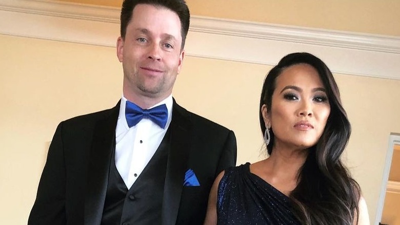 Dr. Pimple Popper posing with husband