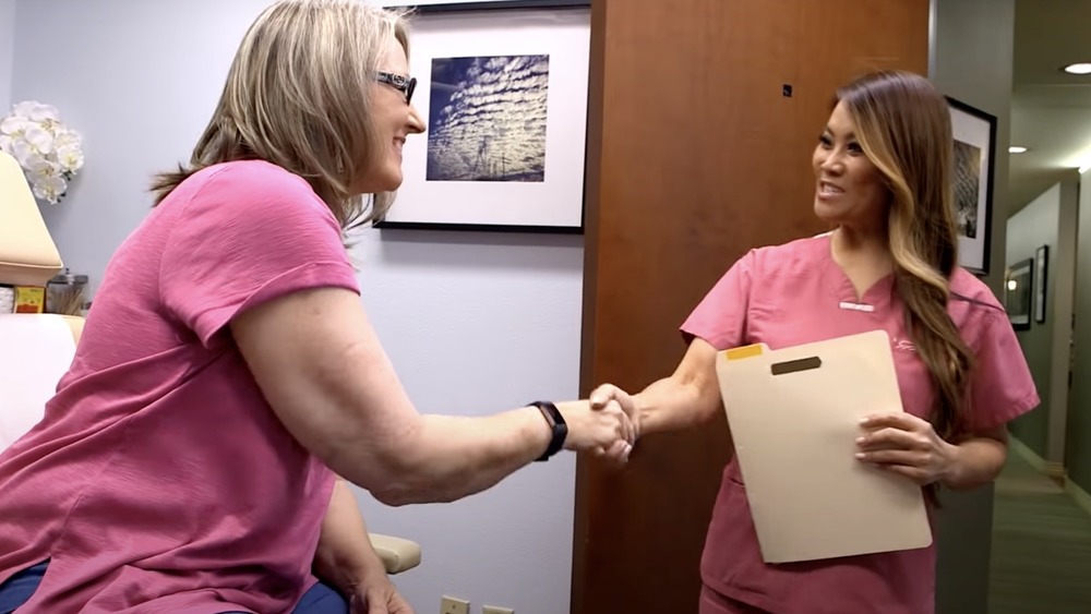 Dr. Pimple Popper shaking hands with a patient