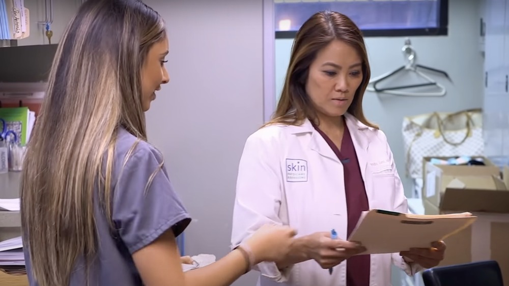 Dr. Pimple Popper with a colleague