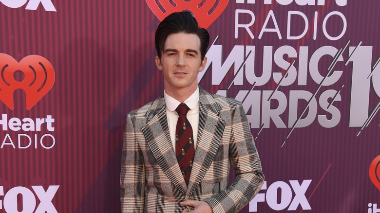 Drake Bell posing on the red carpet