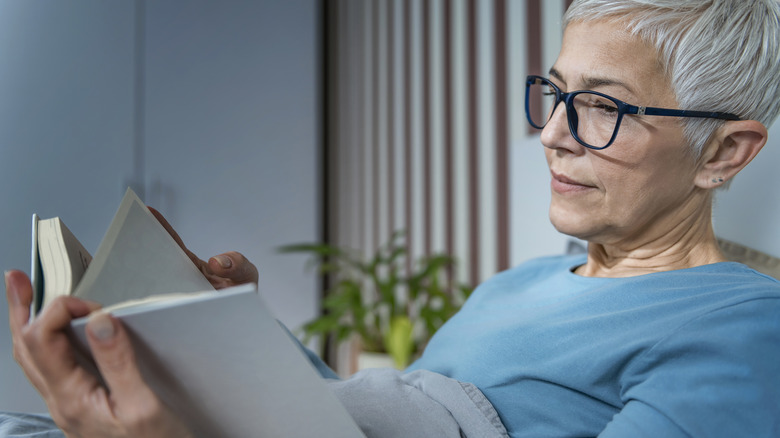 Woman reading before bed