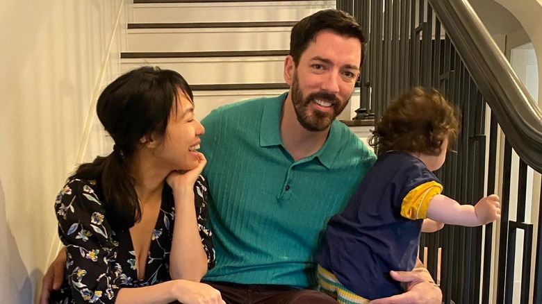 Linda Phan, Drew Scott, Parker Scott sitting on stairs