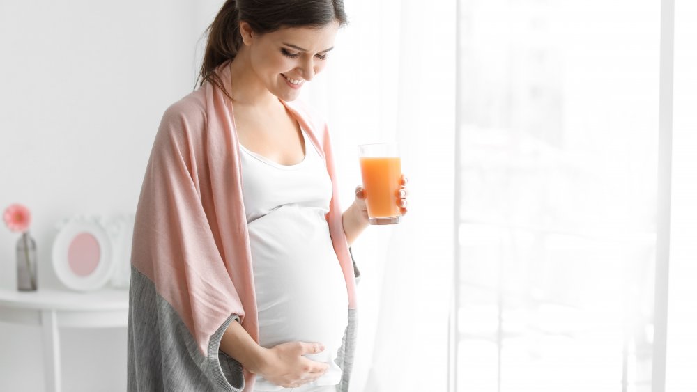 pregnant woman with juice