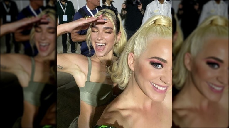 Dua Lipa, Katy Perry posing 