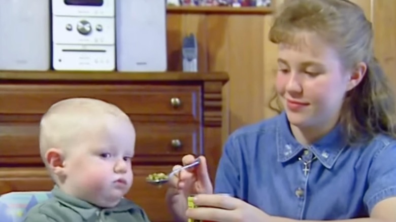 Duggar daughter feeding baby in high chair