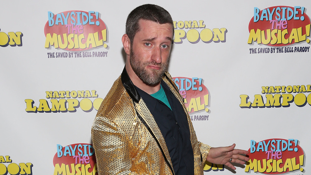 Dustin Diamond striking a funny pose at an event