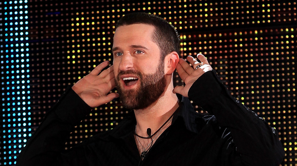 Dustin Diamond posing at event