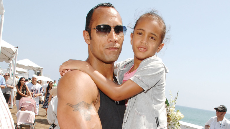 Dwayne Johnson holding Simone Johnson