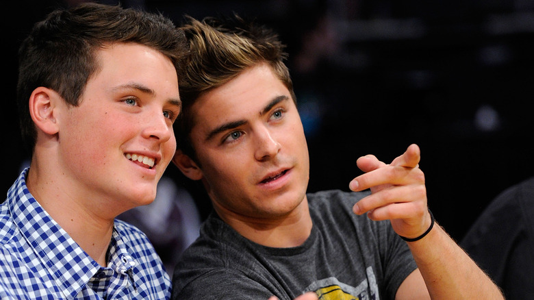 Dylan and Zac Efron at a Laters game