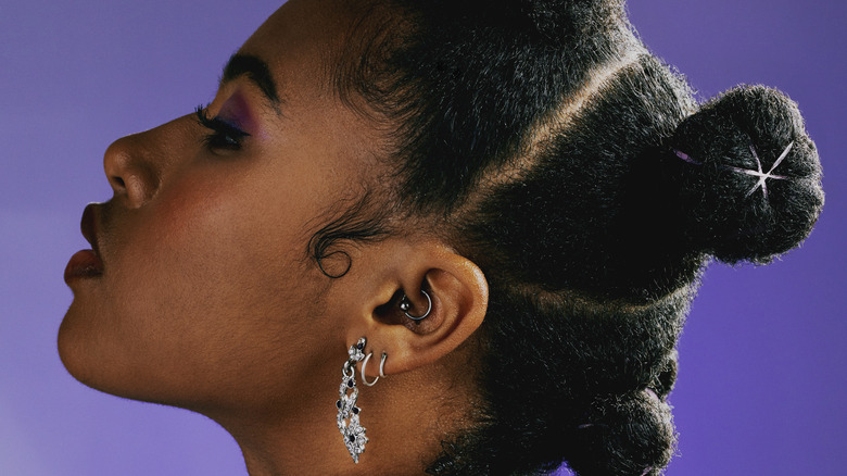 woman with multiple ear piercings