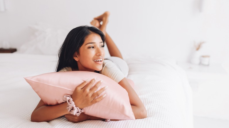 Woman hugging a pillow