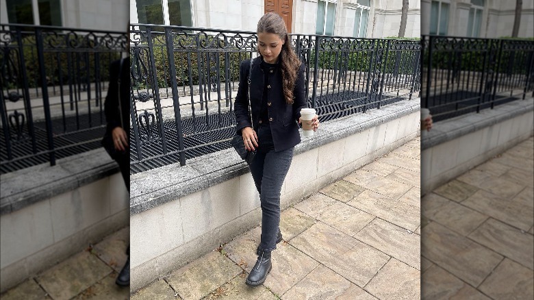 Woman wearing straight leg jeans and ankle boots