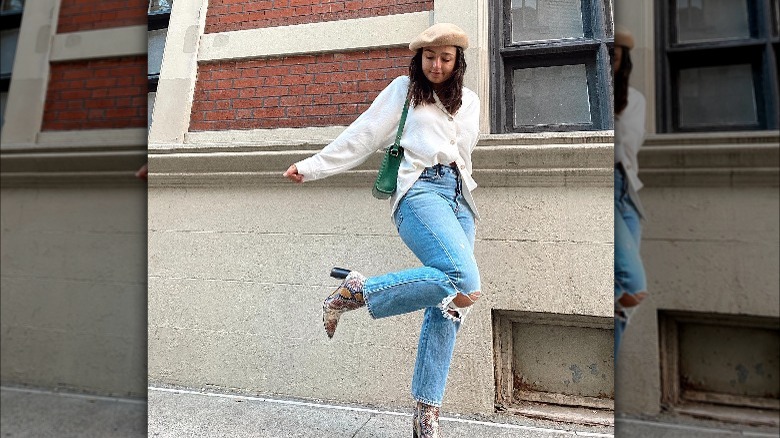 Woman wearing straight leg jeans and ankle boots