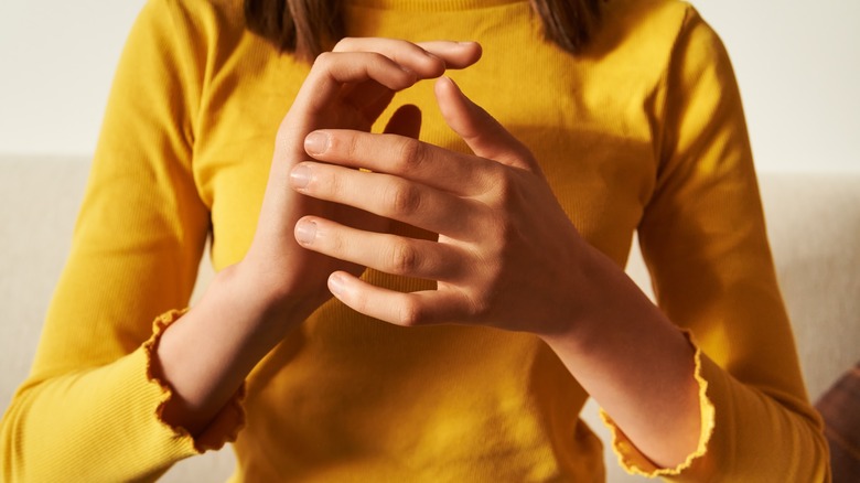 Woman practicing EFT tapping