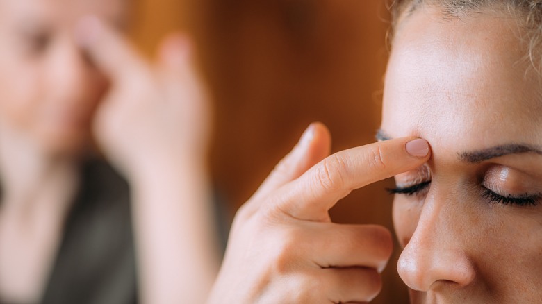 Women practicing EFT tapping