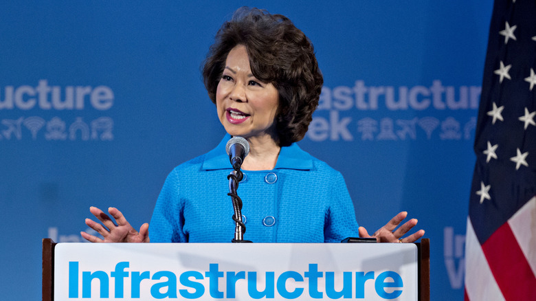 Elaine Chao speaking in microphone