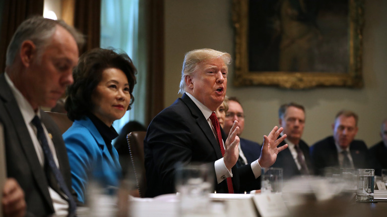 Elaine Chao sitting next to Donald Trump