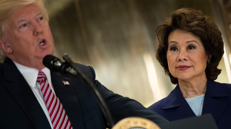 Donald Trump standing next to Elaine Chao