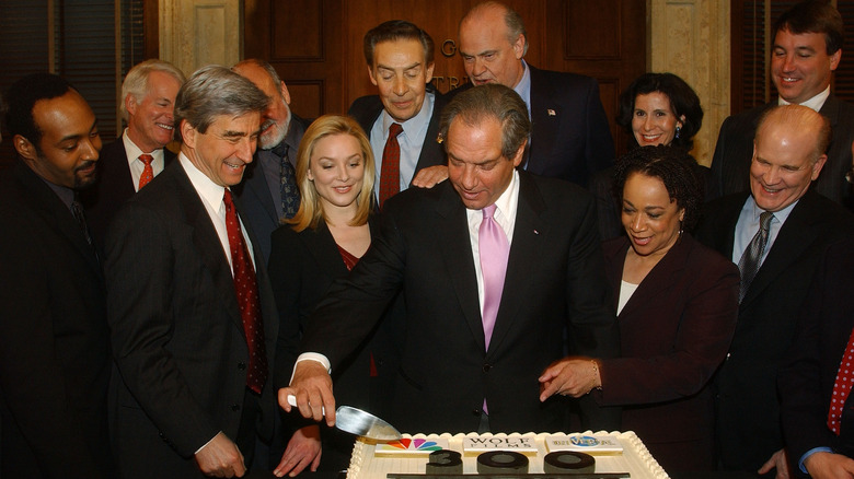 Elisabeth Röhm and cast of Law & Order cutting cake