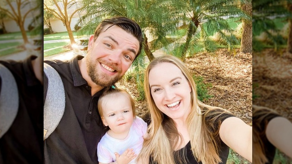 Elizabeth and Andrei with their daughter