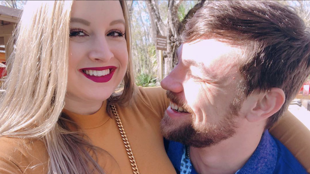 Elizabeth and Andrei smiling in the sun