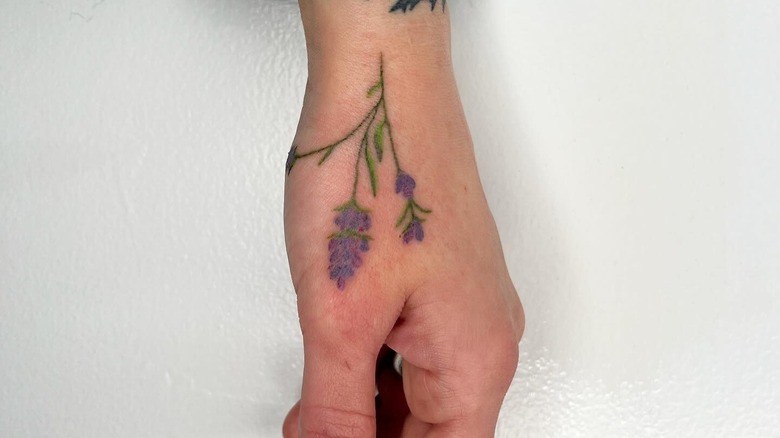 Ella's lavender hand tattoo