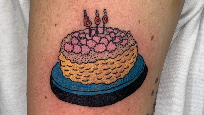 Cake tattoo on Ella Emhoff