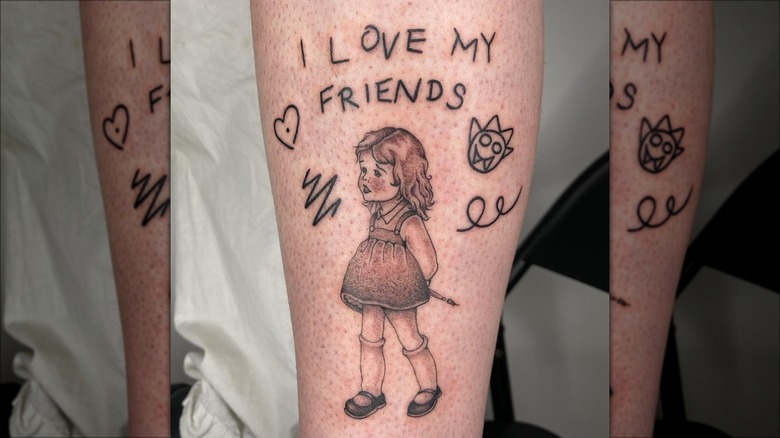 Ella's leg tattoo of little girl