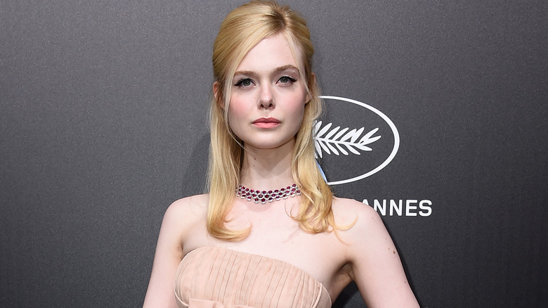 Elle Fanning poses at Cannes