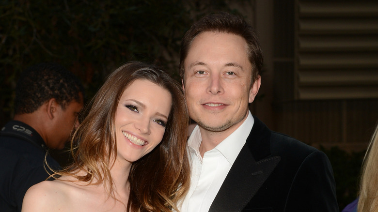 Talulah Riley with Elon Musk smiling at an evening event