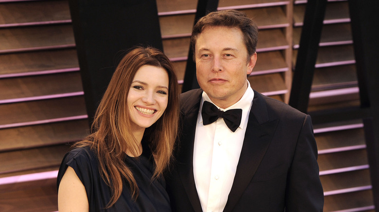 Talulah Riley and Elon Musk smiling at an event