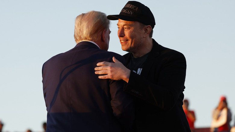 Elon Musk and Donald Trump embracing in 2024