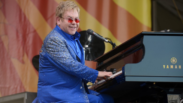 Elton John playing piano