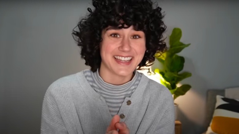 Elyse Myers smiling with curly hair