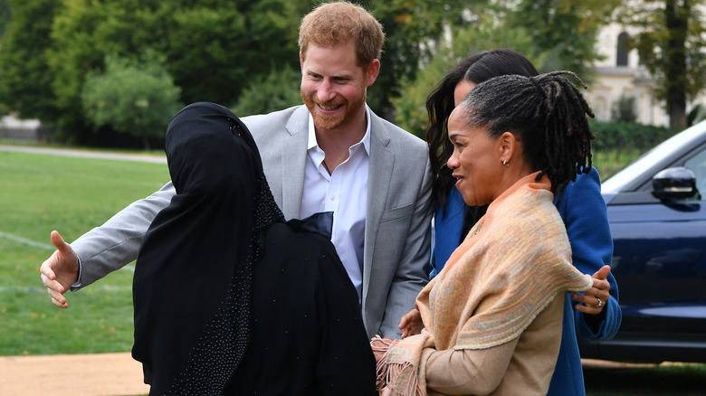 Prince Harry greeting volunteer