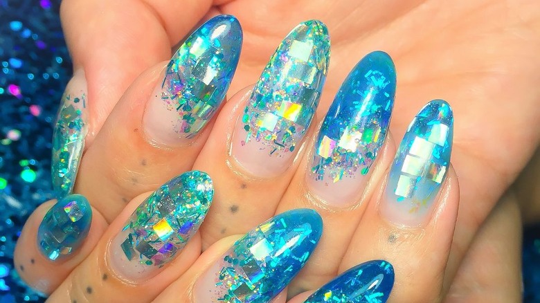 Blue encapsulated glitter nails