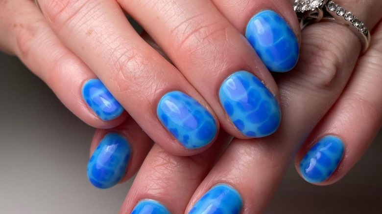 blue crocodile print manicure 