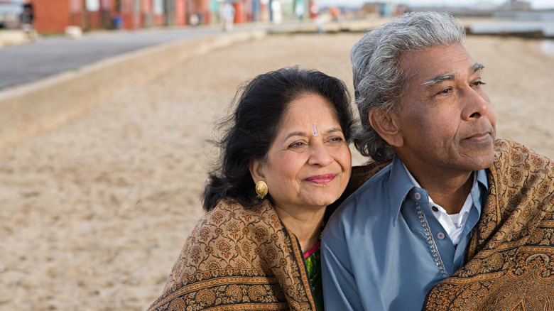 Elderly couple sit together