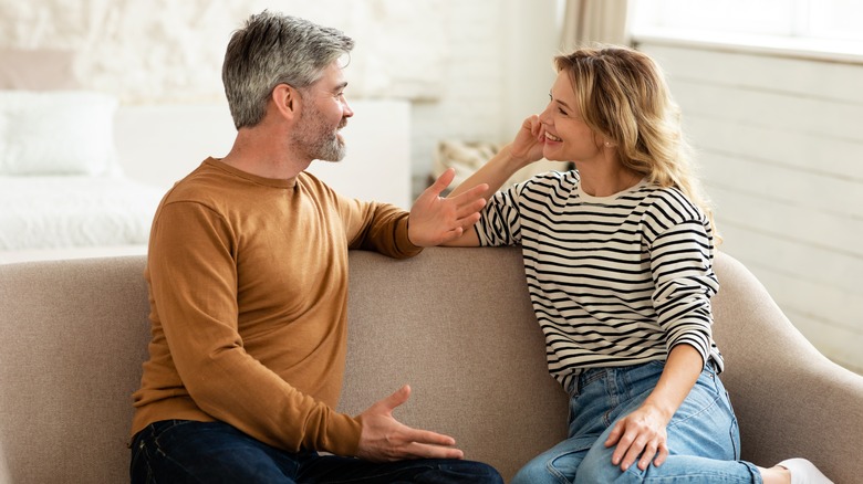 Middle age couple talking to one another