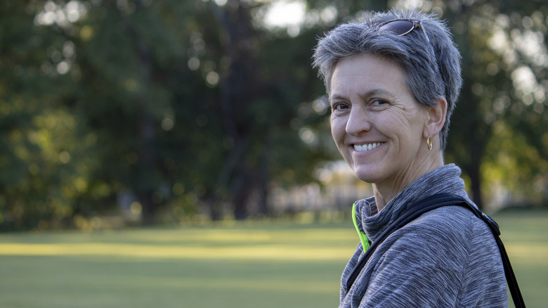 Mature person in the park smiling