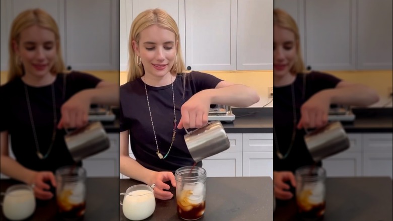 Emma Roberts making a drink with milk