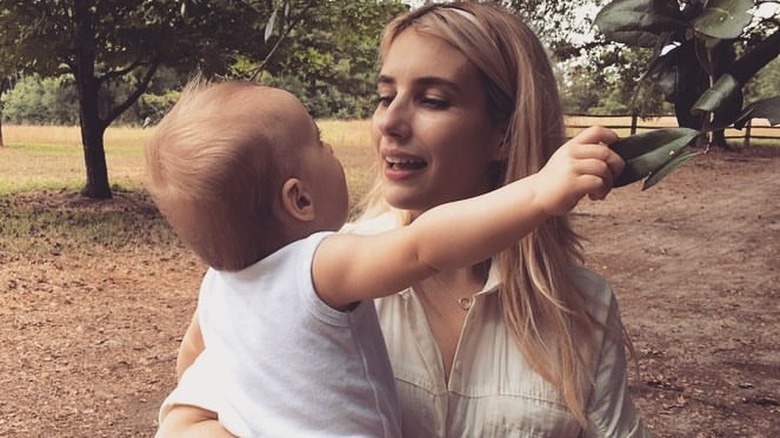 Emma Roberts holding her son, Rhodes