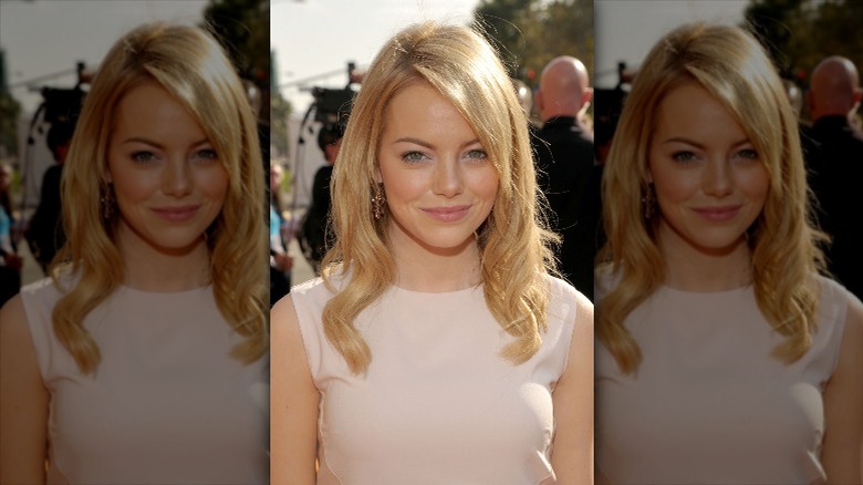 Emma Stone smiling with strawberry blonde hair