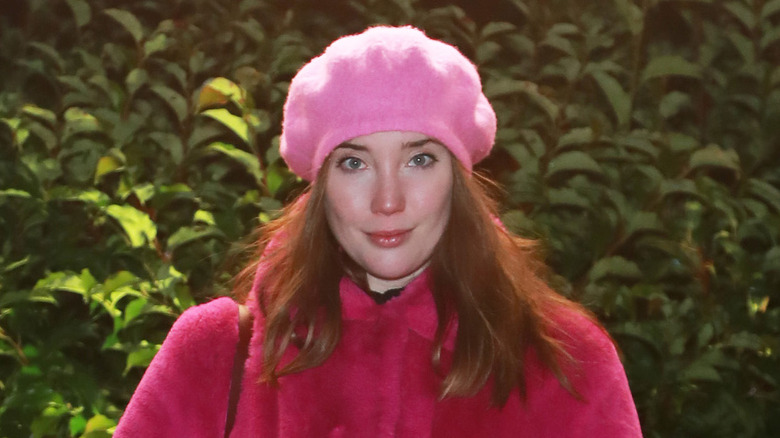 Gaia Wise posing in a pink hat